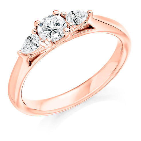 Round Brilliant Trilogy Ring With Pear Cut Shoulders